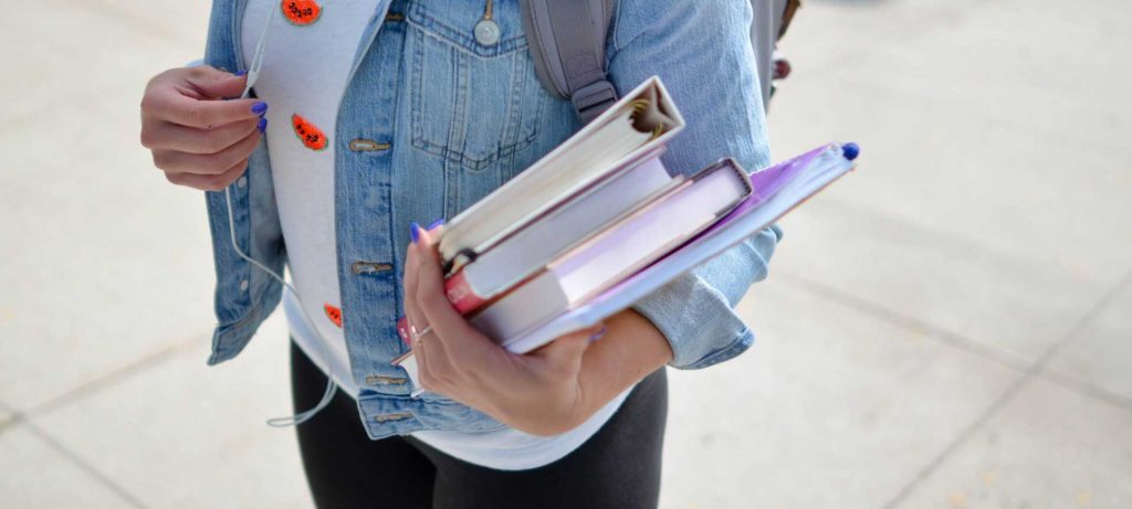 books holding student